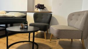Posezení v ubytování Family Apartments Černice