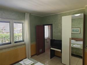 Postel nebo postele na pokoji v ubytování Hotel Roma Sul Mare