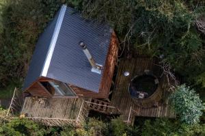 an overhead view of a house with a bat on it at Refugio y Tinaja Curiñanco in Valdivia