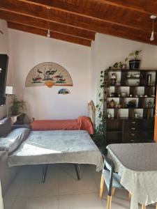 a bedroom with two beds and a book shelf at Depto cerca del Aeropuerto in Comodoro Rivadavia