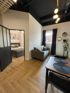 a living room with a couch and a table at Aleja 12 in Częstochowa