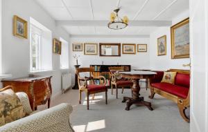 a living room with a table and chairs at Gorgeous Home In Skagen With Wifi in Skagen