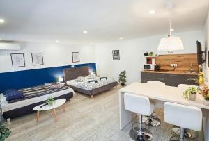 a living room with a couch and a table at Marcos Apartments Victoriei - self check-in in Reşiţa