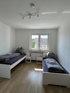 Postel nebo postele na pokoji v ubytování Ferienwohnung Adelsried 2