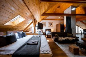 a living room with a large bed in the middle at Vintage Industrial City Apartments in Košice