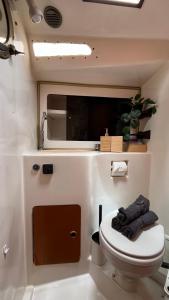 a bathroom with a toilet in a trailer at Velero Puma 32 in Caleta de Sebo +14 photos