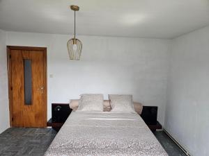 Postel nebo postele na pokoji v ubytování Mam'Ika