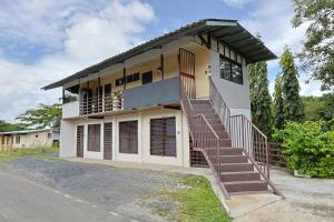 a house with stairs in front of it at D'Rosas Apartments Apto5 in Santiago