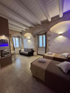 Postel nebo postele na pokoji v ubytování Torre Pendio b&b