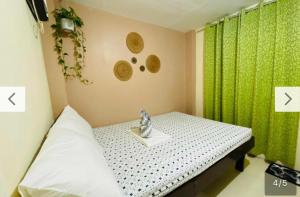 Postel nebo postele na pokoji v ubytování Siargao Zita's Garden Inn