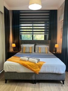Ένα ή περισσότερα κρεβάτια σε δωμάτιο στο HG Mare Suites