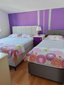Postel nebo postele na pokoji v ubytování Apartment Paša + 37 fotografií