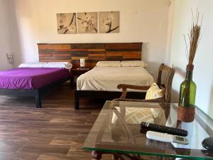 Postel nebo postele na pokoji v ubytování Cancun-Soho