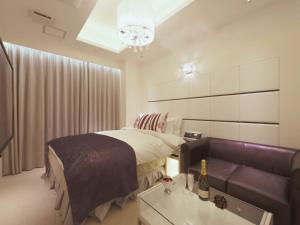 Voodi või voodid majutusasutuse HOTEL GLANZ CASCATA toas