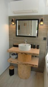 a bathroom with a white sink and a mirror at Casa Louise - Piscine et jacuzzi privatifs in Sainte-Maxime