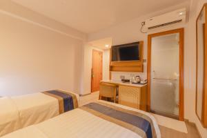 Postel nebo postele na pokoji v ubytování UMET Seaview Hotel with Free Airport Pick up and Drop T&C Apply