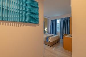 Postel nebo postele na pokoji v ubytování UMET Seaview Hotel with Free Airport Pick up and Drop T&C Apply