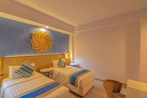 Postel nebo postele na pokoji v ubytování UMET Seaview Hotel with Free Airport Pick up and Drop T&C Apply