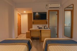 Postel nebo postele na pokoji v ubytování UMET Seaview Hotel with Free Airport Pick up and Drop T&C Apply