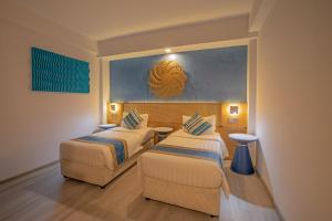 Postel nebo postele na pokoji v ubytování UMET Seaview Hotel with Free Airport Pick up and Drop T&C Apply