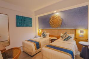 Postel nebo postele na pokoji v ubytování UMET Seaview Hotel with Free Airport Pick up and Drop T&C Apply