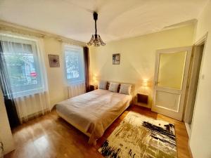 Posteľ alebo postele v izbe v ubytovaní Rézi Apartman