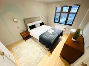 Ένα ή περισσότερα κρεβάτια σε δωμάτιο στο Luxury Central London flats, convenient for tourists