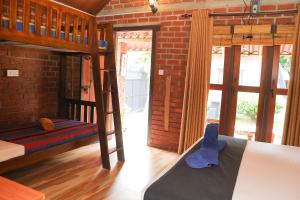 Postel nebo postele na pokoji v ubytování Negombo The Nature Villa and Cabanas
