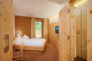 Posteľ alebo postele v izbe v ubytovaní Hotel Madatsch + 37 fotografií