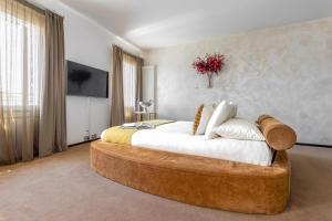 Postel nebo postele na pokoji v ubytování MURANO Suites BOUTIQUE Apartments