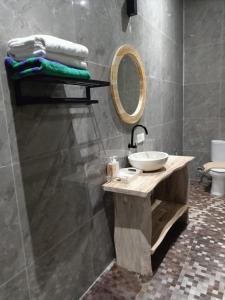 a bathroom with a sink and a mirror at Otila Bali Villa in Uluwatu +70 photos