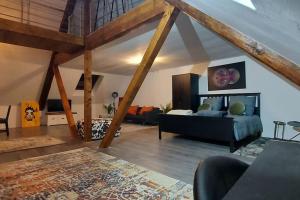 a large living room with a couch and a table at Stilvoll & Wohlfühlfaktor! in Nohfelden