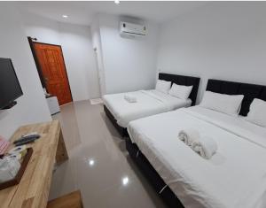 Postel nebo postele na pokoji v ubytování Vamin Resort Chiangkhan Loei วามินทร์รีสอร์ท เชียงคาน เลย