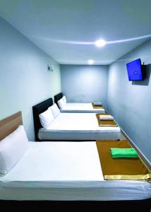 Postel nebo postele na pokoji v ubytování ARK HOTEL SUBANG