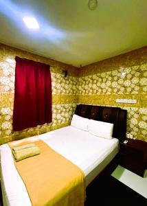 Postel nebo postele na pokoji v ubytování ARK HOTEL SUBANG