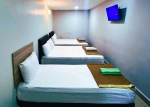 Postel nebo postele na pokoji v ubytování ARK HOTEL SUBANG