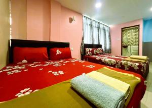 Postel nebo postele na pokoji v ubytování ARK HOTEL SUBANG