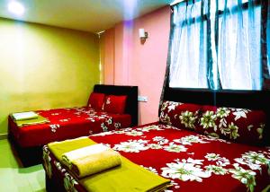 Postel nebo postele na pokoji v ubytování ARK HOTEL SUBANG