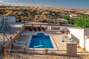 Swimmingpoolen hos eller tæt på Alojamiento Cuevas Victoria