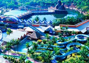 an aerial view of a water park at a theme park at ARK HOTEL MELAWATI in Kuala Lumpur