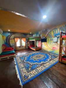 a room with a mural on the wall at Evergreen Lodge in Padang