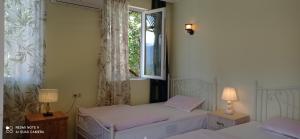 Letto o letti in una camera di GUEST HOUSE RIMAS HOME