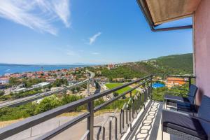 a balcony with chairs and a view of the ocean at Tonka Roberta 2 in Crikvenica