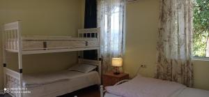 Letto o letti in una camera di GUEST HOUSE RIMAS HOME