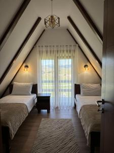Postel nebo postele na pokoji v ubytování Village Moticki Gaj