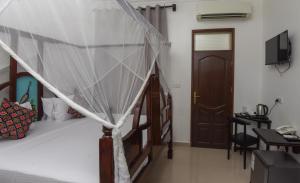 Postel nebo postele na pokoji v ubytování Zanzibar View Hotel