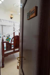 Postel nebo postele na pokoji v ubytování Zanzibar View Hotel