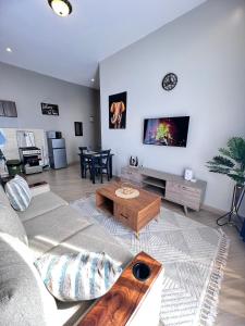 a living room with a couch and a table at Skyline residence Kyanja in Kampala