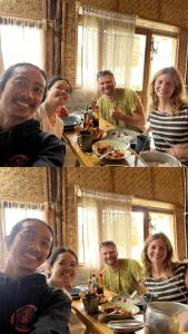a group of people sitting at a table eating food at rk.homestay in Rantepao +24 photos