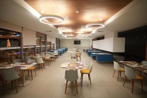 a dining room with tables and chairs and a classroom at Zephyr Agadir in Agadir
